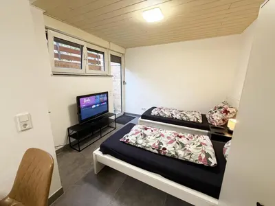 Ein Bett oder Betten in einem Zimmer der Unterkunft Ferienwohnung in Egelsbach bei Frankfurt am Main