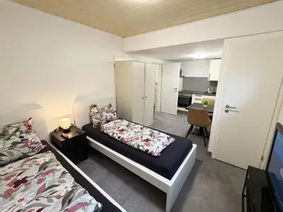 Ein Bett oder Betten in einem Zimmer der Unterkunft Ferienwohnung in Egelsbach bei Frankfurt am Main