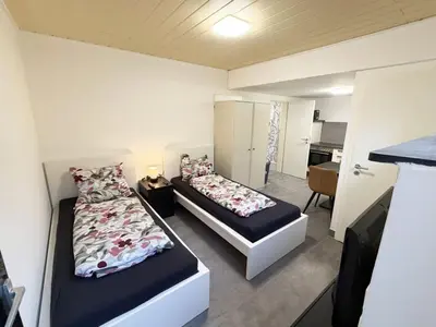 Ein Bett oder Betten in einem Zimmer der Unterkunft Ferienwohnung in Egelsbach bei Frankfurt am Main