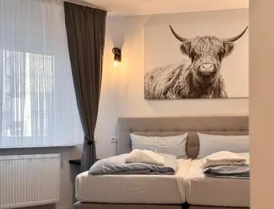 Ein Bett oder Betten in einem Zimmer der Unterkunft Modern City Apartment Pforzheim frieden apartments