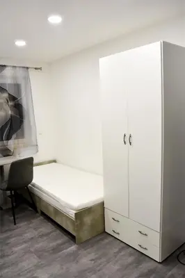 Ein Bett oder Betten in einem Zimmer der Unterkunft Five Rooms
