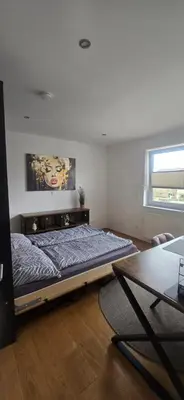 Ein Bett oder Betten in einem Zimmer der Unterkunft Stilvolle Unterkunft mit Wohlfühlfaktor