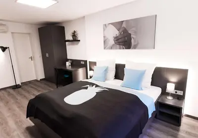 Ein Bett oder Betten in einem Zimmer der Unterkunft Mood Studios