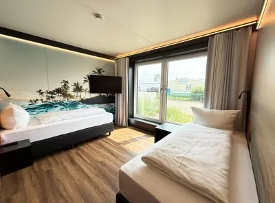 Ein Bett oder Betten in einem Zimmer der Unterkunft ILS Hotel by WMM Hotels