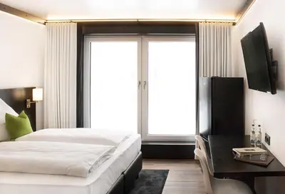 Ein Bett oder Betten in einem Zimmer der Unterkunft ILS Hotel by WMM Hotels