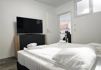 Ein Bett oder Betten in einem Zimmer der Unterkunft Modern Living nearby RheinHafen mit Balkon und Parken - Apolonia Living