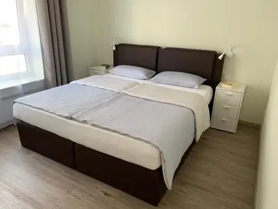 Ein Bett oder Betten in einem Zimmer der Unterkunft Große Ferienwohnung mit Balkon in Sankt Martin, Pfalz