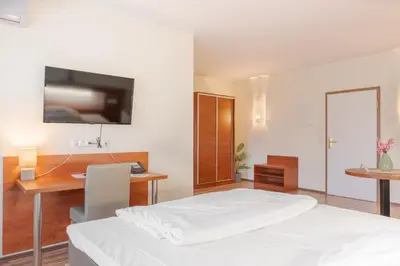 Ein Bett oder Betten in einem Zimmer der Unterkunft Hotel Victoria
