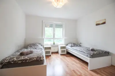 Ein Bett oder Betten in einem Zimmer der Unterkunft nJoy! Business Apartment Neckarsulm - nähe Audi & Balkon