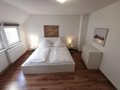 Ein Bett oder Betten in einem Zimmer der Unterkunft Ferienwohnungen Neckarblick - Heidelberg Altstadt