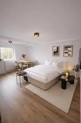 Ein Bett oder Betten in einem Zimmer der Unterkunft MIRANA Home l Modernes Apartment Kaiserslautern