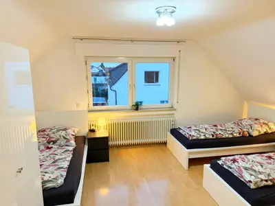 Ein Bett oder Betten in einem Zimmer der Unterkunft Vollausgestattete Wohnung für Selbstversorger