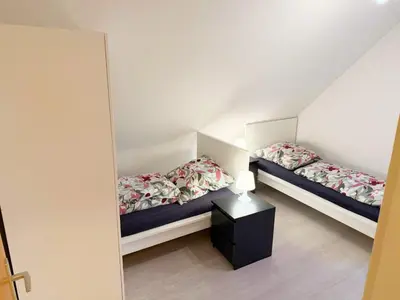 Ein Bett oder Betten in einem Zimmer der Unterkunft Vollausgestattete Wohnung für Selbstversorger