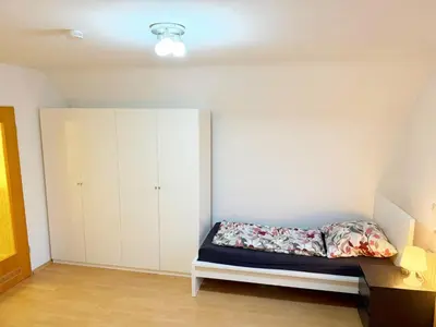 Ein Bett oder Betten in einem Zimmer der Unterkunft Vollausgestattete Wohnung für Selbstversorger