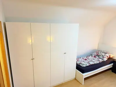 Ein Bett oder Betten in einem Zimmer der Unterkunft Vollausgestattete Wohnung für Selbstversorger