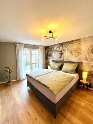 Ein Bett oder Betten in einem Zimmer der Unterkunft Stilvolles & helles Apartment mit Sonnen-Terrasse