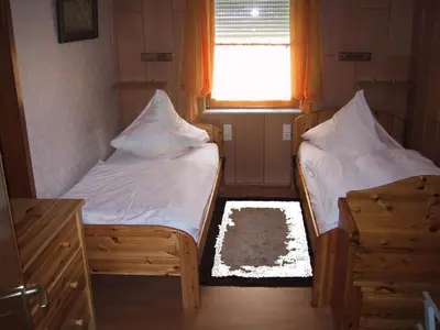 Ein Bett oder Betten in einem Zimmer der Unterkunft Apartment mit Pool und überdachtem Balkon by Interhome