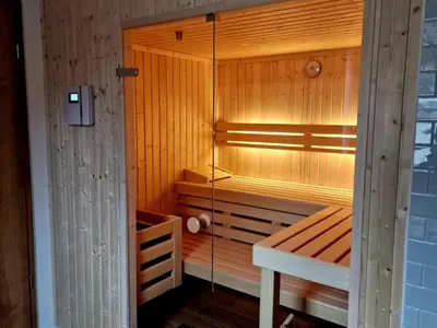 Ein Bett oder Betten in einem Zimmer der Unterkunft Holiday Home Luxus-Blockhausparadies Eveningwood im Spessart by Interhome