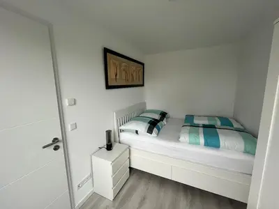 Ein Bett oder Betten in einem Zimmer der Unterkunft Beautiful apartment in Bürstadt