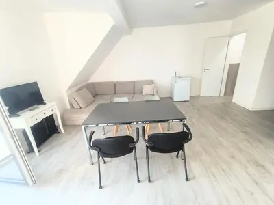 Ein Sitzbereich in der Unterkunft Apartment mit Balkon