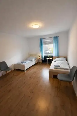 Ein Bett oder Betten in einem Zimmer der Unterkunft Land Lord Apartments 3-4 Sleeping Rooms near Frankfurt am Main