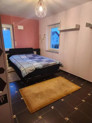 Ein Bett oder Betten in einem Zimmer der Unterkunft Schönes Einfamilienhaus in Nackenheim, Germany