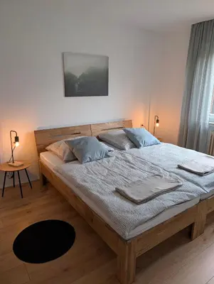 Ein Bett oder Betten in einem Zimmer der Unterkunft Apartment am Kurpark