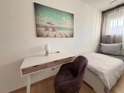 Ein Bett oder Betten in einem Zimmer der Unterkunft AG Deluxe Ferienwohnung in Kornwestheim