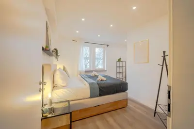 Ein Bett oder Betten in einem Zimmer der Unterkunft Schlossberg Residences XXL City-Apartment Heppenheim