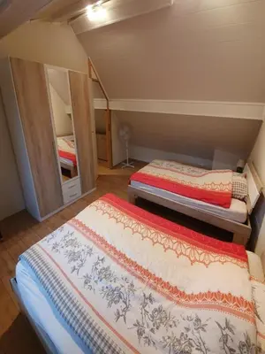 Ein Bett oder Betten in einem Zimmer der Unterkunft Gästehaus Alte Küferei