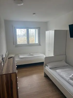 Ein Bett oder Betten in einem Zimmer der Unterkunft Teamhaus mit großer Küche - Platz für 10