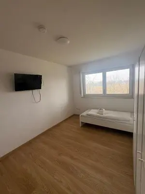 Ein Bett oder Betten in einem Zimmer der Unterkunft Teamhaus mit großer Küche - Platz für 10