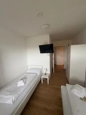 Ein Bett oder Betten in einem Zimmer der Unterkunft Teamhaus mit großer Küche - Platz für 10