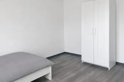 Ein Bett oder Betten in einem Zimmer der Unterkunft Monteur- und Ferienunterkunft Waghäusel