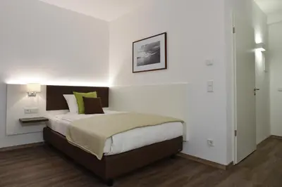 Ein Bett oder Betten in einem Zimmer der Unterkunft Guesthouse Lichtenau