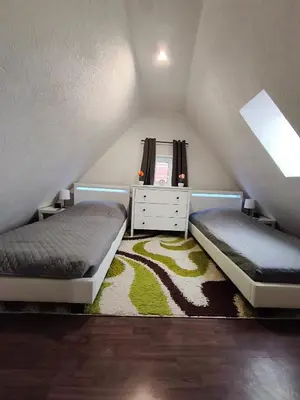 Ein Bett oder Betten in einem Zimmer der Unterkunft Zuhause G24 in Bönnigheim - Bis zu 6 Personen - 5 Minuten bis Tripsdrill