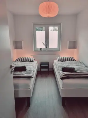 Ein Bett oder Betten in einem Zimmer der Unterkunft Ferienwohnung BellaPfalz