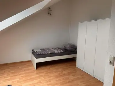 Ein Bett oder Betten in einem Zimmer der Unterkunft 4 Personen I 2 Schlafzimmer I Wohnung Wörrstadt mit Parkplatz