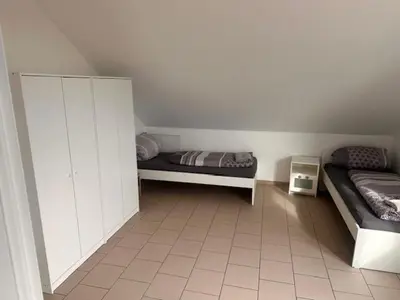 Ein Bett oder Betten in einem Zimmer der Unterkunft 4 Personen I 2 Schlafzimmer I Wohnung Wörrstadt mit Parkplatz