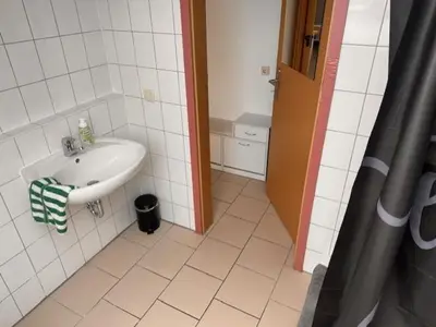 Ein Badezimmer in der Unterkunft 4 Personen I 2 Schlafzimmer I Wohnung Wörrstadt mit Parkplatz
