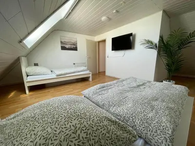 Ein Bett oder Betten in einem Zimmer der Unterkunft Wohnung 4 Eppertshausen