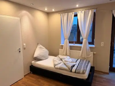 Ein Bett oder Betten in einem Zimmer der Unterkunft Monteur Darius