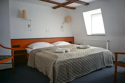 Ein Bett oder Betten in einem Zimmer der Unterkunft Steingarten Hotel