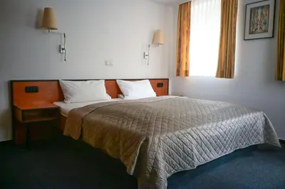 Ein Bett oder Betten in einem Zimmer der Unterkunft Steingarten Hotel