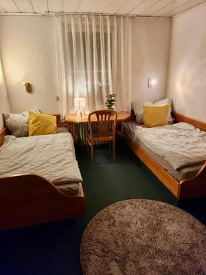 Ein Bett oder Betten in einem Zimmer der Unterkunft Hotel zur Linde