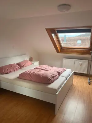 Ein Bett oder Betten in einem Zimmer der Unterkunft 2 Zimmerwohnung
