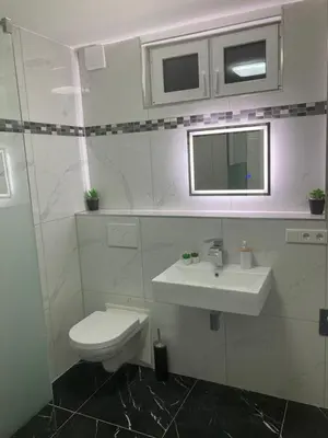 Ein Badezimmer in der Unterkunft SjFewo