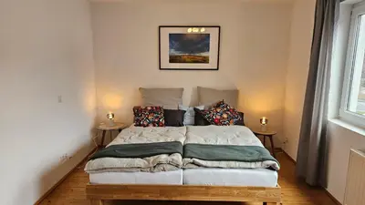 Ein Bett oder Betten in einem Zimmer der Unterkunft WohnRiesling
