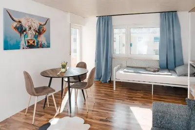 Ein Bett oder Betten in einem Zimmer der Unterkunft Lichtdurchflutetes City-Apartment mit 5 Betten