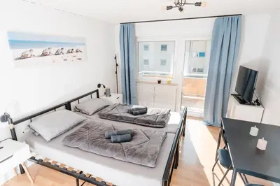 Ein Bett oder Betten in einem Zimmer der Unterkunft Lichtdurchflutetes City-Apartment mit 5 Betten